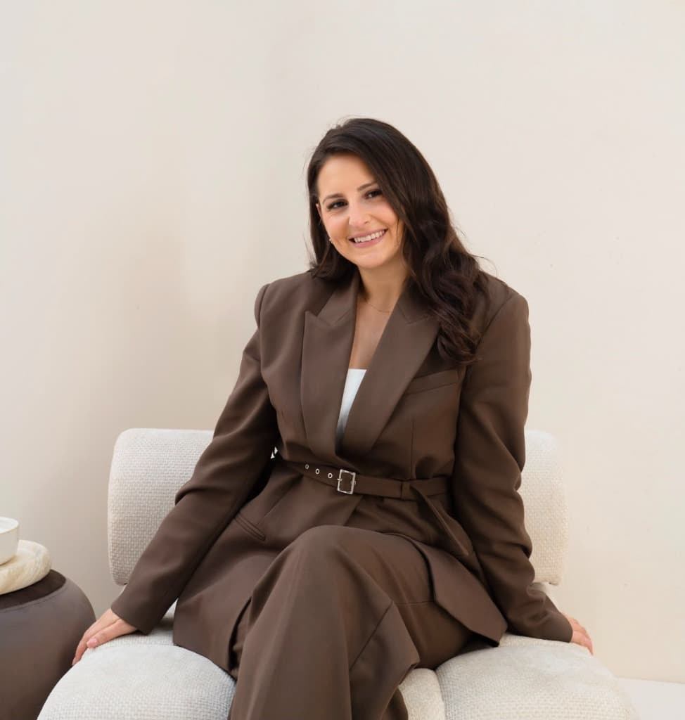 Dr Asena Bulbul seated in the clinic