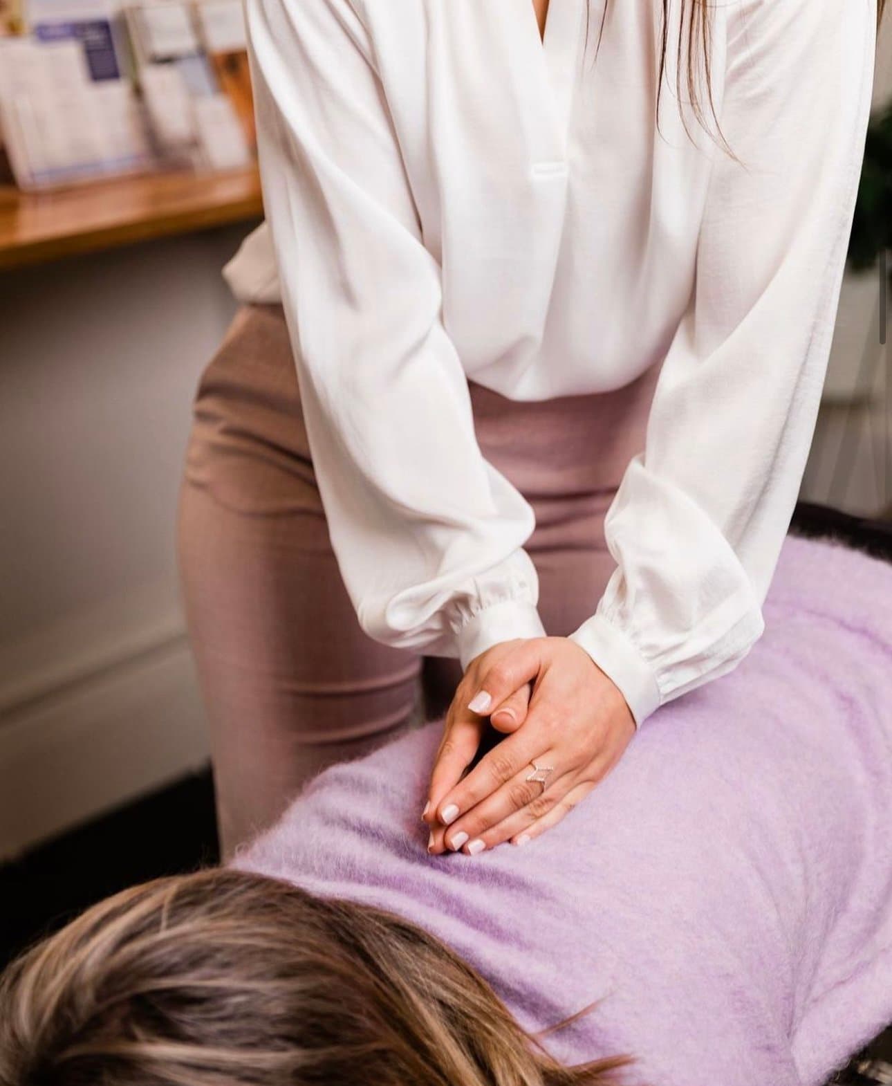 Chiropractor performing an adjustment on a patient