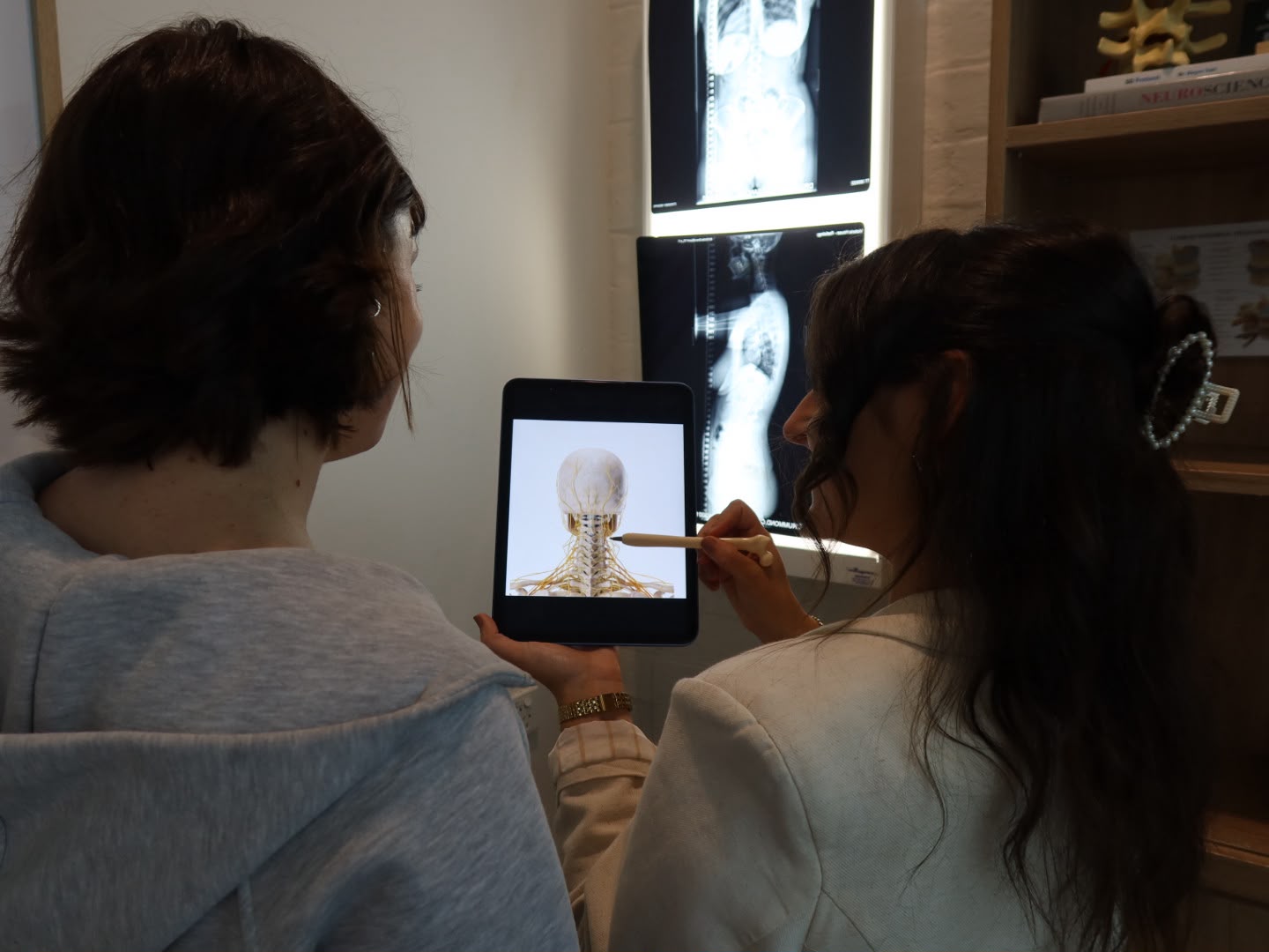 Chiropractor performing a neurological and neck assessment